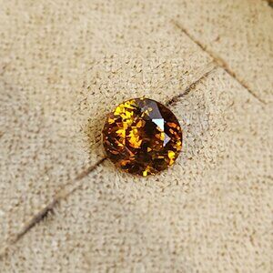 Sphene 7.18mm x 6.88mm x 4.30mm Oval 1.47ct Loose Gemstone